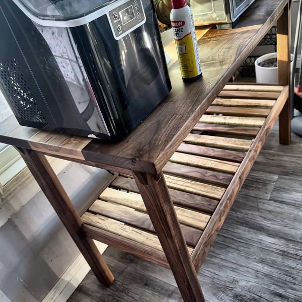 Walnut console table: slatted shelf, side view